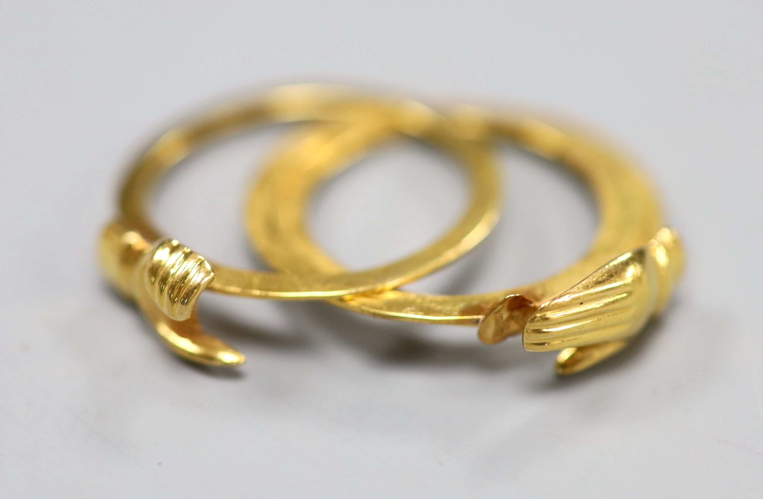 A yellow metal triple shank fede ring, opening to reveal a heart engraved with the letter M, size Q, 6.1 grams.